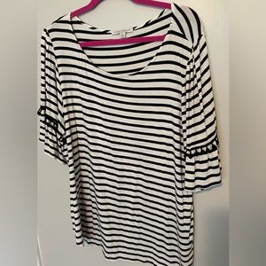 Stretchy black and white top with Pom Pom detail